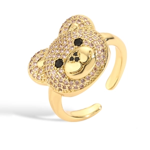 Detail of a gold adjustable ring featuring a micro-paved teddy bear head with colorful gems
