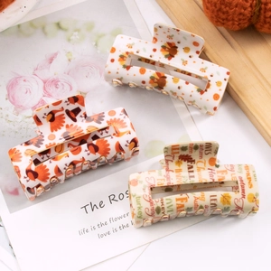 Three-piece Thanksgiving hair claw clips set featuring turkey, maple leaf, and fall patterns