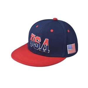Detail of embroidered USA letters and flag on a navy blue and red flat bill baseball cap