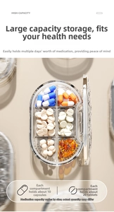 Detailed macro view of a six-compartment portable pill box showing various capsules and pills