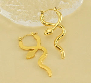 Close-up of gold snake hoop earrings featuring a realistic wrap design and metallic finish