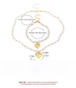 Mesures détaillées de l'ensemble collier et bracelet à perles et cœur doré