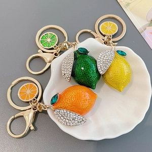 Creative fruit-shaped keychains with rhinestones in lemon, lime and orange styles