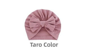 Detail of taro purple baby turban hat featuring a large soft bow and ribbed knit texture