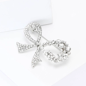 Elegant silver bow brooch with sparkling rhinestones for women's blazer accessories