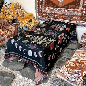 Bohemian moon phase camping blanket with floral patterns and decorative tassels