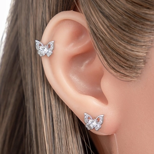 Silver butterfly cartilage studs with heart zirconia stones in a titanium steel screw design