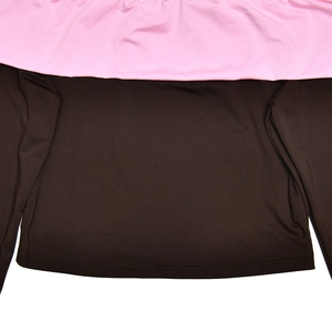 Close-up of pink ruffle hem detail on the back of a slim fit contrast long sleeve top