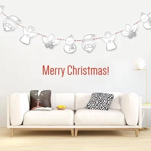 Silver Merry Christmas hanging banner with Santa and snowman motifs on a white wall