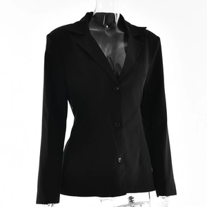 Detailed view of women's black long sleeve blazer with three-button design and lapels