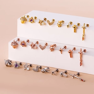 Surgical steel stud earrings in gold, rose gold and silver with various shaped charms