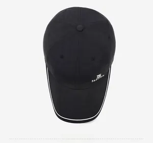 Detailed top view of black quick-dry baseball cap with white Fashion logo and piping