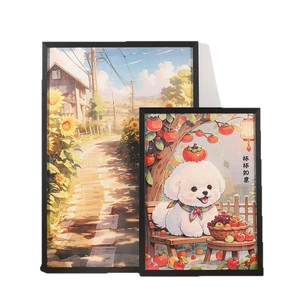 Solid wood puzzle frames in black finish showcasing sunflower and puppy illustrations