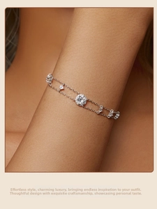 Close-up of double-layer S925 silver bracelet featuring a large round moissanite center