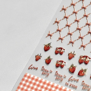 3D embossed nail art stickers featuring strawberry, cherry, and bow motifs in Japanese style