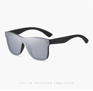 Close-up of polarized sunglasses with silver lenses and black frames for driving