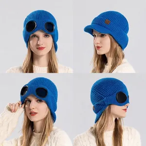 Winter fleece-lined knitted hat for women with integrated goggles in bright blue