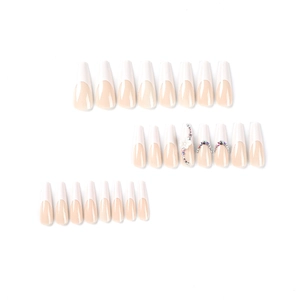 Long white French coffin press-on nails with 3D white flowers and sparkling rhinestones
