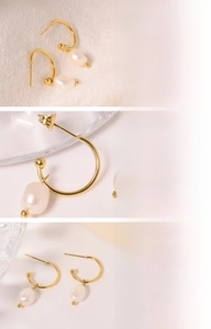 Macro detail of Baroque freshwater pearl pendant with gold plated titanium steel hoop