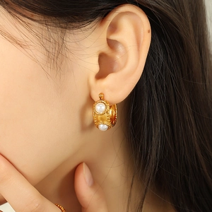 French vintage gold C-shaped titanium steel earrings with pearls on model's ear