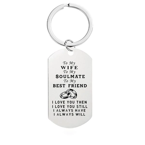 Detail of silver stainless steel dog tag keychain with engraved romantic quote for wife