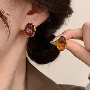 Irregular resin earrings with 18K gold plating and amber red geometric design