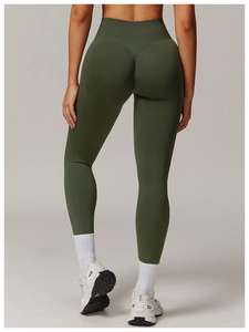 Detail view of high-waist dark green yoga pants showcasing butt-lifting seamless design