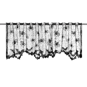 Close-up of black lace Halloween mantel scarf with spider web and bat patterns