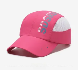 Close-up of pink quick-dry baseball cap with white mesh sides and sports embroidery
