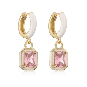 Detail of gold drop earrings with white enamel and rectangular pink cubic zirconia