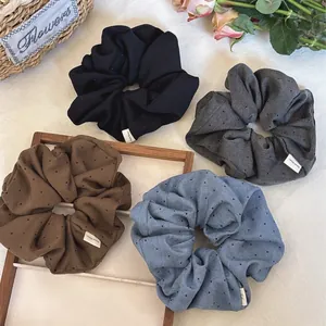 Retro rhinestone fabric scrunchies set in black, gray, brown, and blue colors