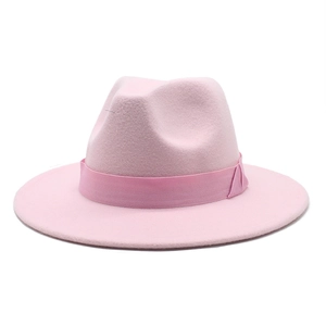 Close-up of pink wool fedora hat with matching ribbon trim and flat brim detail
