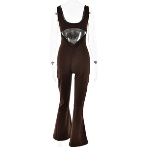 Detail view of deep brown jumpsuit featuring a low U-neckline and sexy open back design