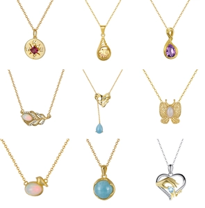 Nine diverse bohemian necklaces featuring natural stones, compass, leaf, and heart pendants
