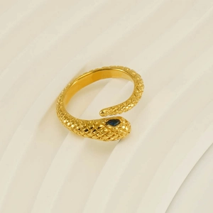 Close-up of golden snake ring with blue marquise stone and detailed scale texture