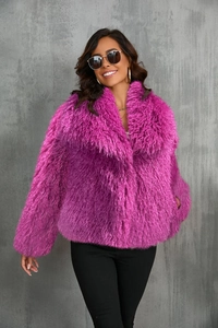 Detail shot of plush magenta faux fox fur coat with a large wide lapel and fluffy texture