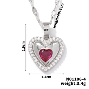 Macro shot of heart pendant with red stone, including size specs 1.9x1.4cm and weight 3.4g