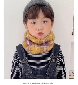 Close-up of kids' knitted neck warmer with yellow and purple checkered pattern