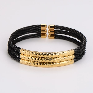 Three-layer black cable open cuff bracelet with gold textured metal accents for men