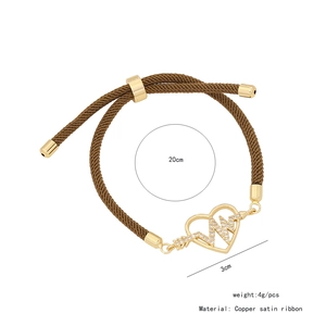 Bracciale regolabile in corda marrone con ciondolo a cuore in rame dorato e zirconi
