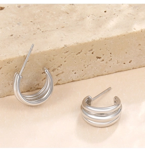 Detail view of S925 sterling silver triple-layer C-shaped hoop earrings with metallic luster