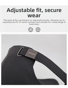 Detail of adjustable metal buckle and fabric strap on dark gray baseball cap