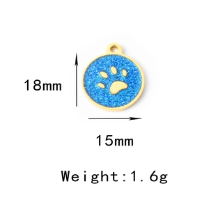 Detailed size view of paw print pendant measuring 18mm by 15mm in gold and blue glitter