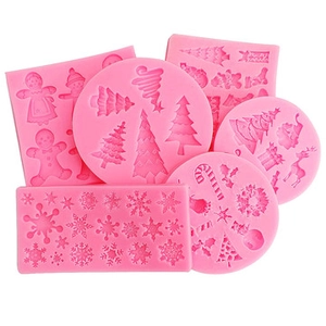 Detailed view of 6-piece pink silicone Christmas baking molds with snowflake and tree shapes