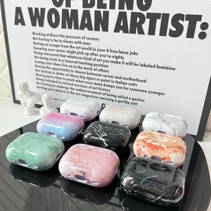 Detailed display of nine assorted marble pattern protective cases for AirPods Pro 2