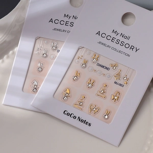 Christmas nail art charms with gold and silver rhinestone snowman and elk designs