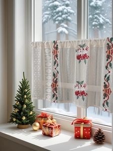 Close-up of Christmas coffee curtain with bell embroidery and delicate lace edge
