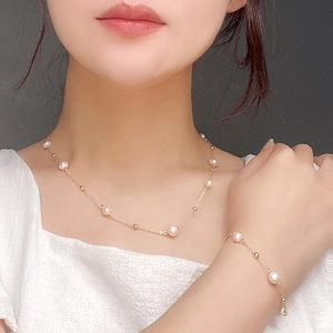 Elegant natural pearl necklace and bracelet set with golden beads for women