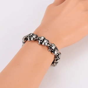 Vintage stainless steel skull link bracelet for men featuring a bold gothic design