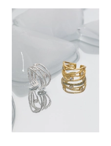 Close-up of S925 sterling silver rings with layered lava texture and inlaid zircons